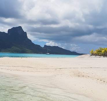 White sand beach and lagoon at Motu Fanfan in Bora Bora