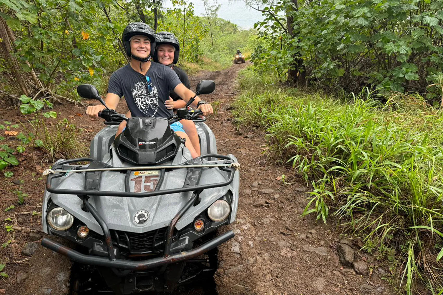 ATV rider on Mount Popoti overlooking the Bora Bora lagoon