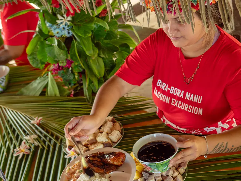Motu Fanfan lagoon setting in Bora Bora with a traditional Polynesian lunch